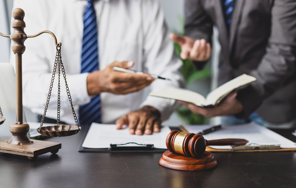 What to expect in probate court | crowl crowl Lawyer Discussing Legal Case and Working with Contract Two Lawyers Deeply Discussing a Complex Legal Case Reviewing Document and Consulting a Law Book in Office