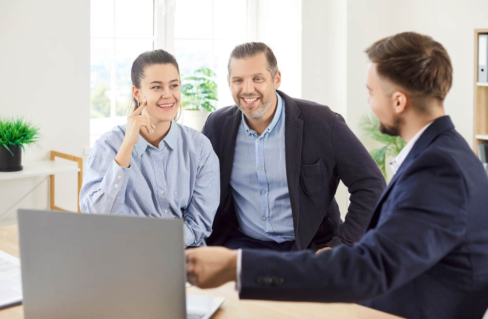 Couple meeting with a financial advisor to discuss family planning